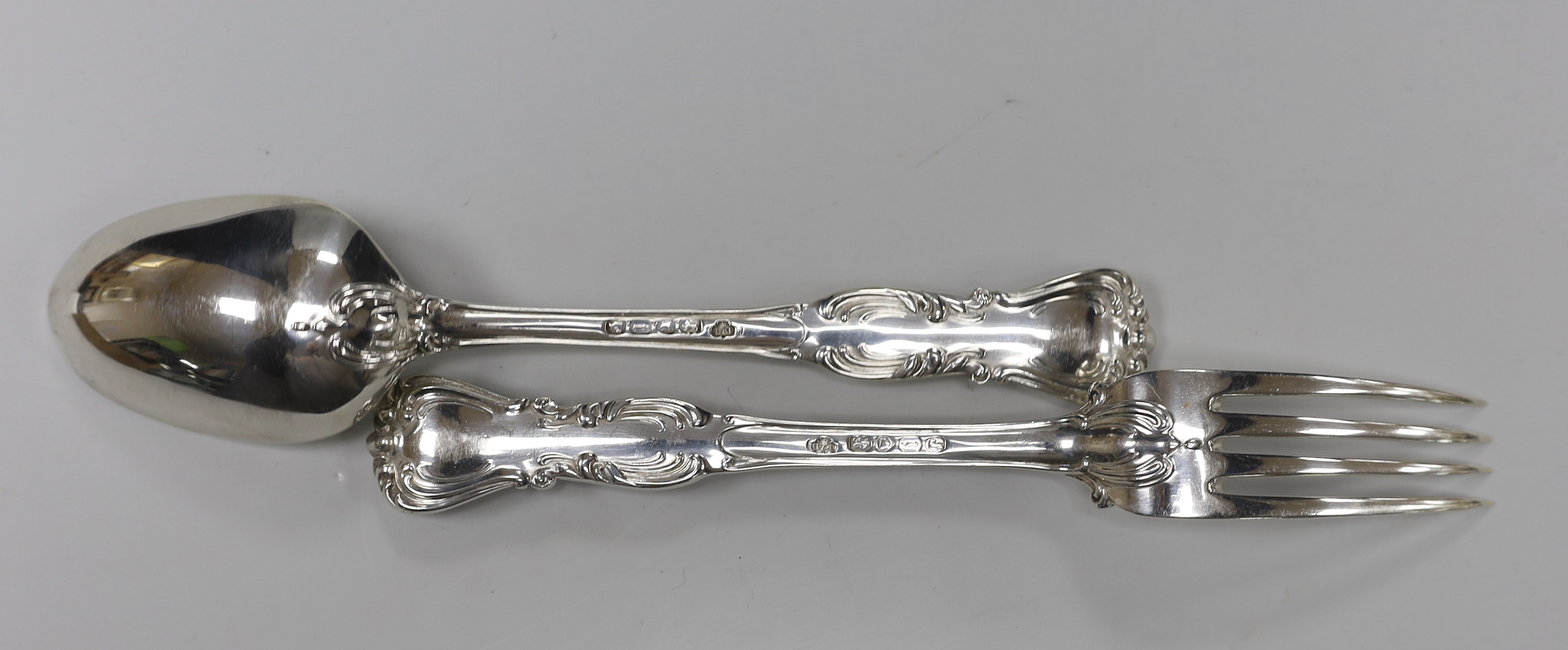 A set of six Victorian silver fancy pattern table spoons and four table forks by John Samuel Hunt, London, 1864 and two similar table forks by George Adams, London, 1848, 37.2oz.
